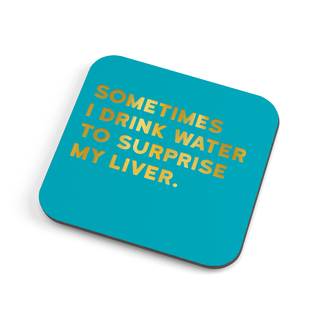 A funny (colour) coaster with gold foiled text saying: "Sometimes I drink water to surprise my liver."
