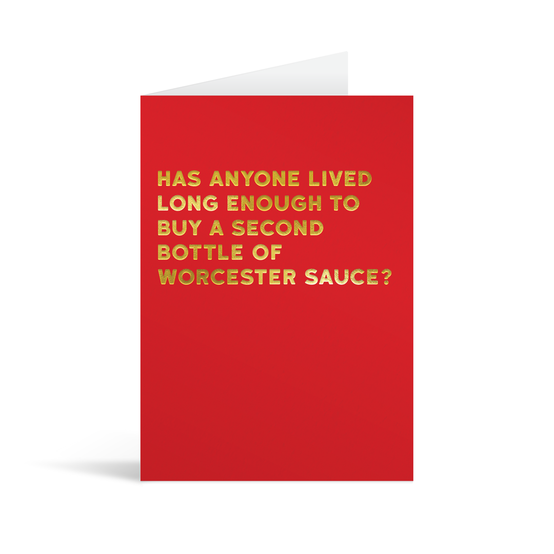 Red rectangular card with gold foiled text saying "Has anyone lived long enough to buy a second bottle of worcester sauce?"