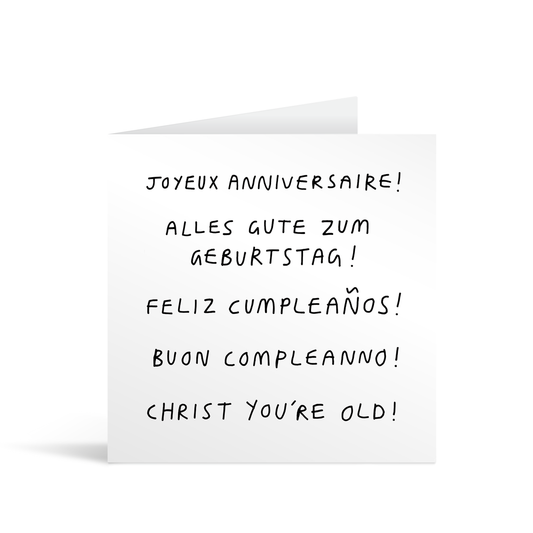 A white square comic style card with funny text saying happy birthday in multiple languages, and "christ you're old!"