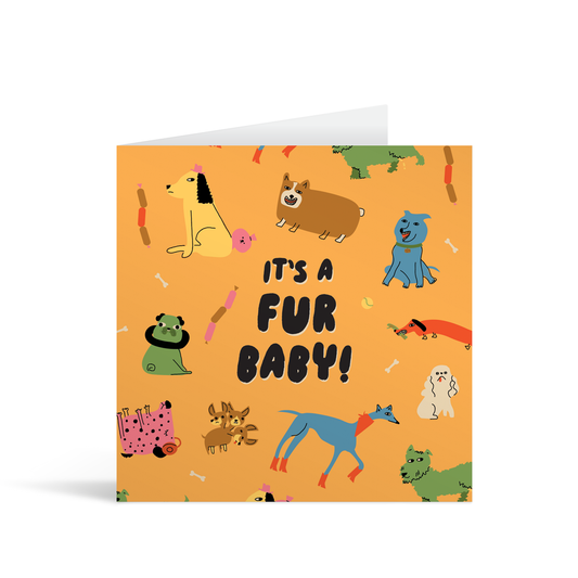 An orange square card with several different illustrated pooches and the text "It's a fur baby!" in playful lettering. Brown envelope in background.