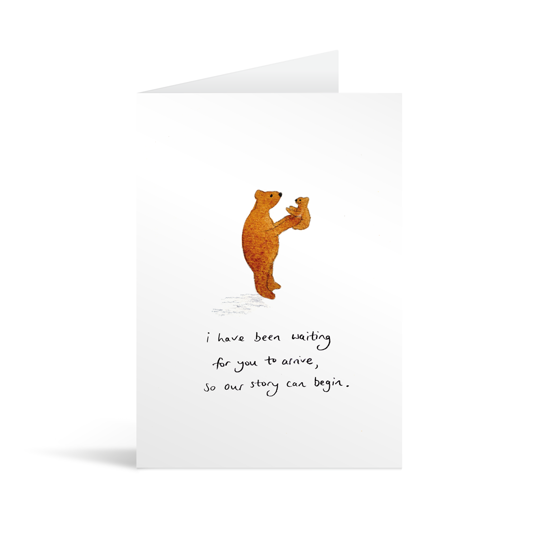 White rectangular card with watercolour illustrated bear holding a baby bear above handwriting that reads "I have been waiting for you to arrive, so that our story can begin"
