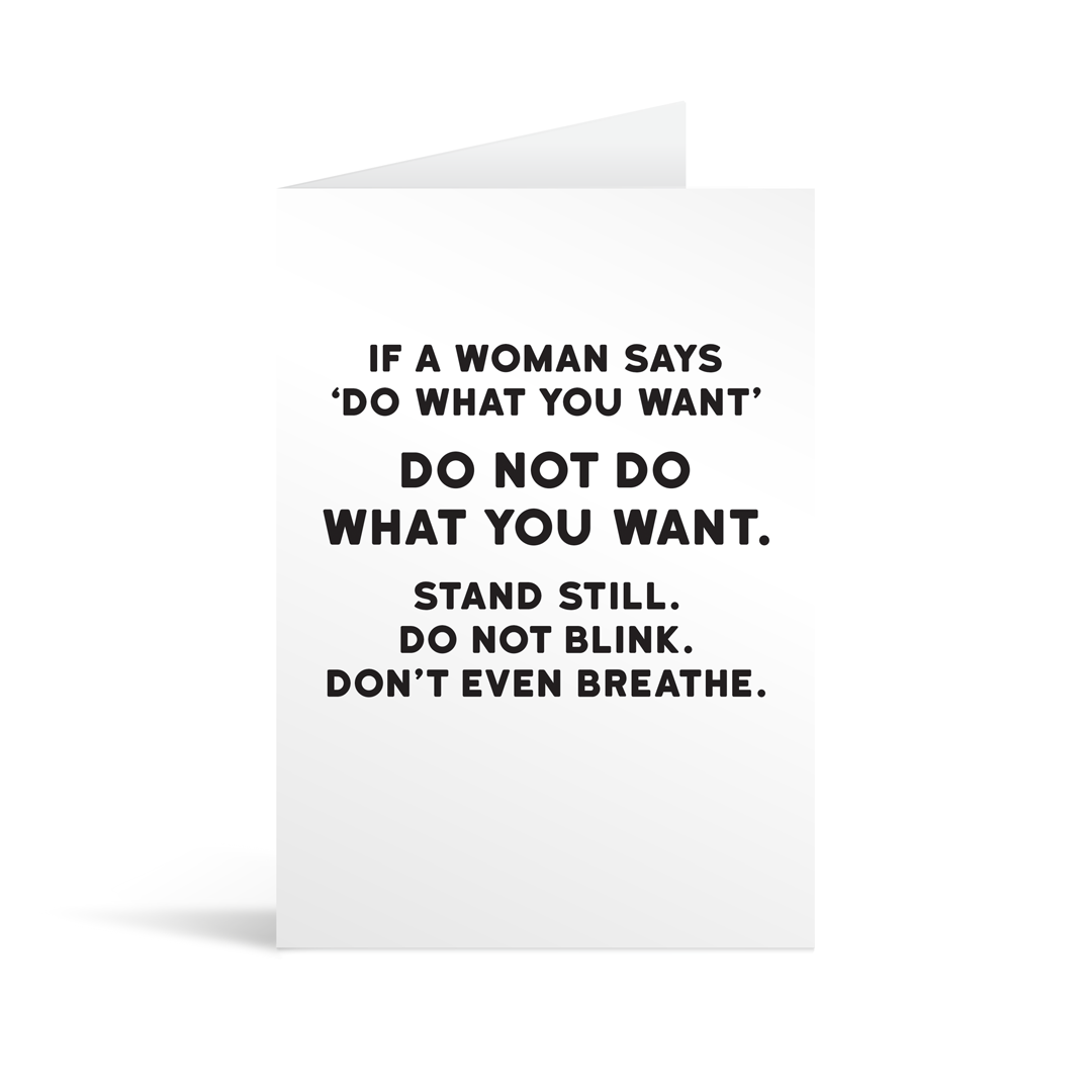White rectangular card with black text saying: "If a woman says 'do what you want' do not do what you want. Stand still. Do not blink. Don't even breathe."