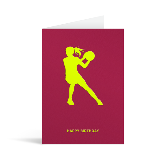 Burgundy card with neon yellow sillhouette of a female netball player above text that reads Happy Birthday