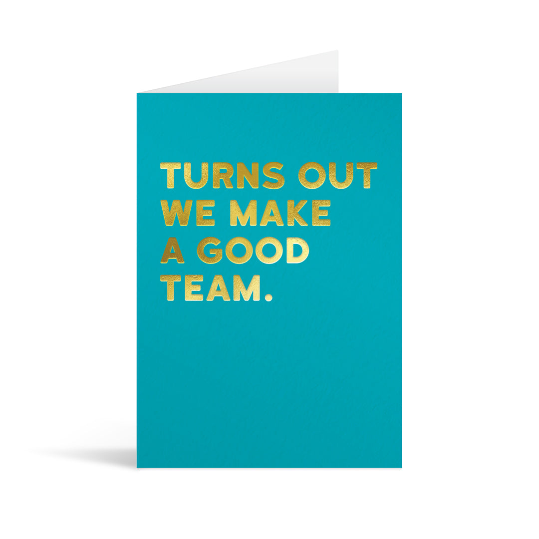 Teal card with gold foiled text reading "Turns out we make a good team".