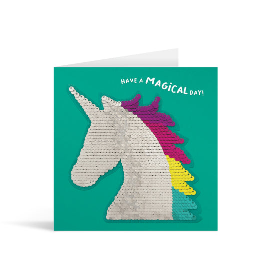 Green square greetings card with colourful shiny sequin unicorn reversible patch and fun, free-flowing text that reads "Have a Magical Day"