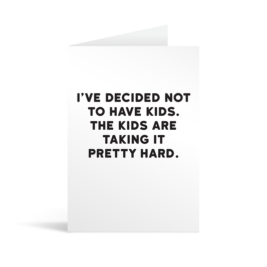 White rectangular card with black text saying: "I've decided not to have kids. The kids are taking it pretty hard."