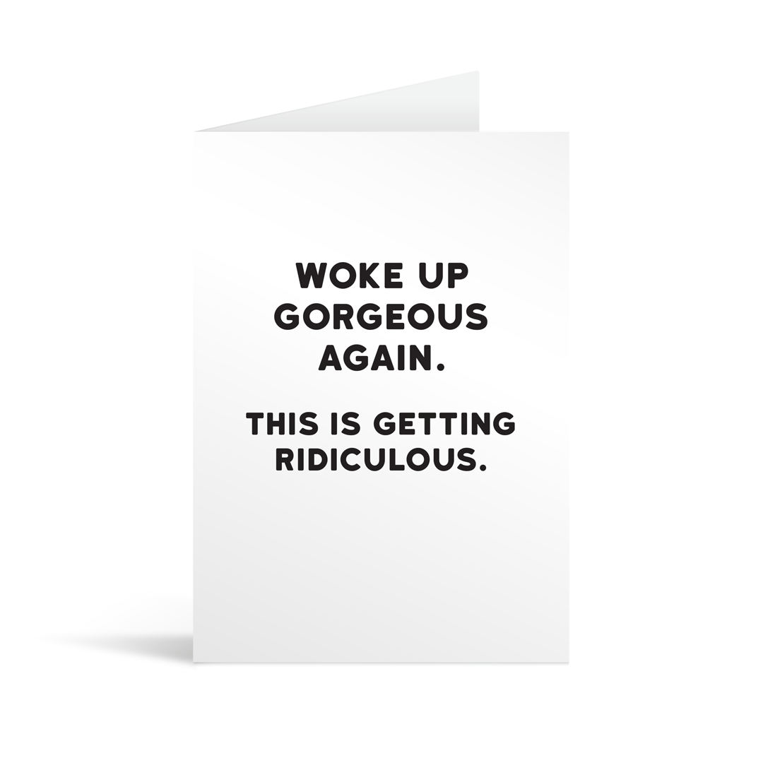 White rectangular card with black bold text reading "Woke up gorgeous again. This is getting ridiculous." Neon orange envelope in the background.