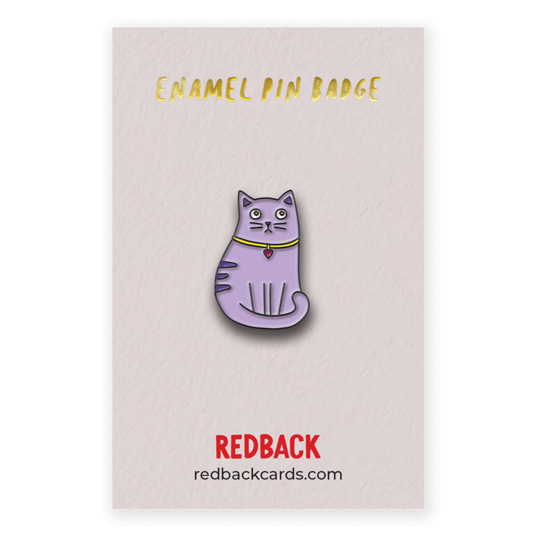 A cute cartoon purple cat enamel pin with black detailing. Mounted on card