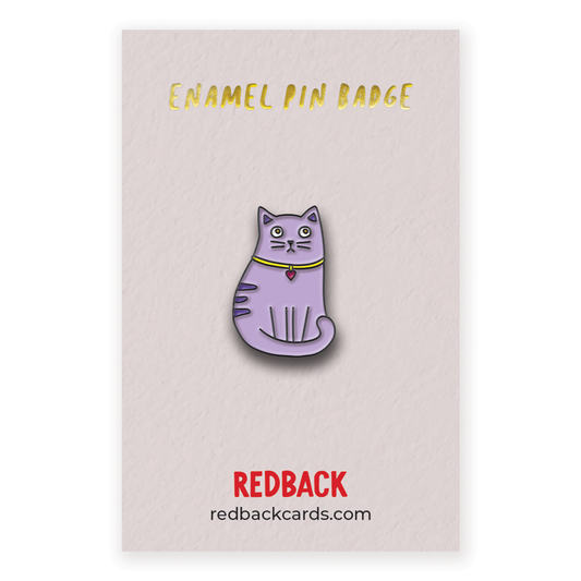 A cute cartoon purple cat enamel pin with black detailing. Mounted on card