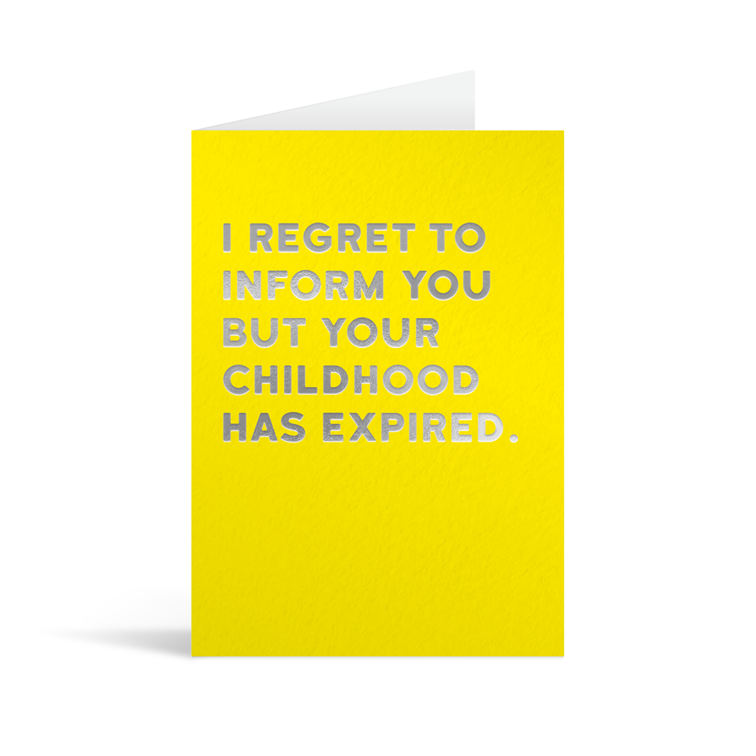 Bright yellow card with silver foiled text saying: "I regret to inform you but your childhood has expired."