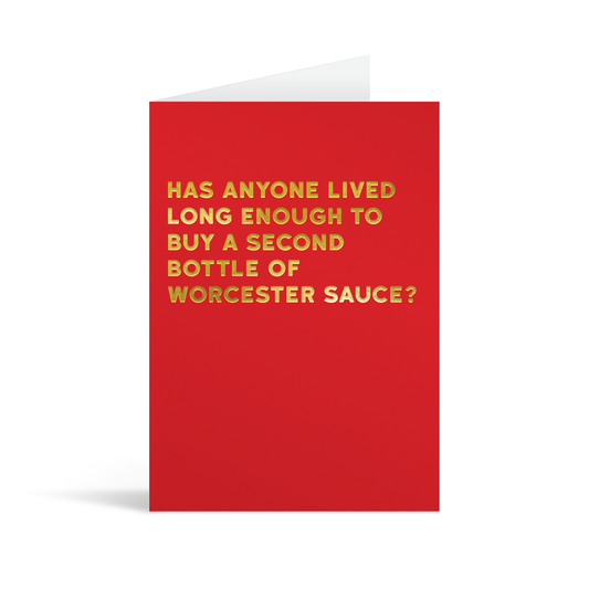 Red rectangular card with gold foiled text saying "Has anyone lived long enough to buy a second bottle of worcester sauce?" 