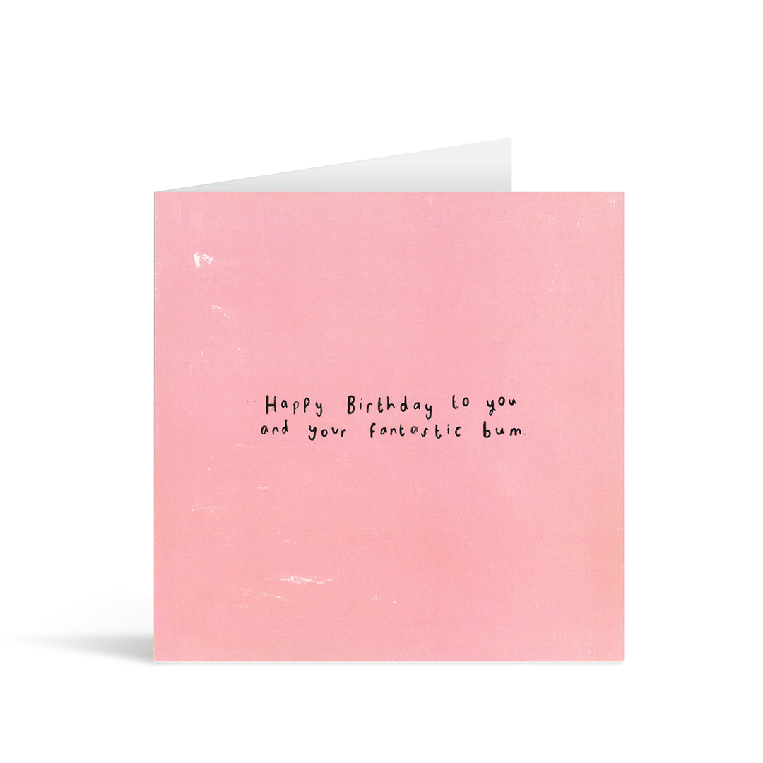 A textured pink card with the handwritten words "Happy birthday to you and your fantastic bum"