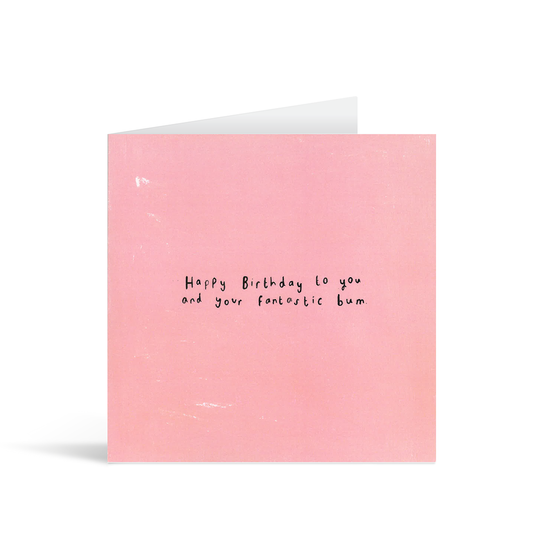 A textured pink card with the handwritten words "Happy birthday to you and your fantastic bum"