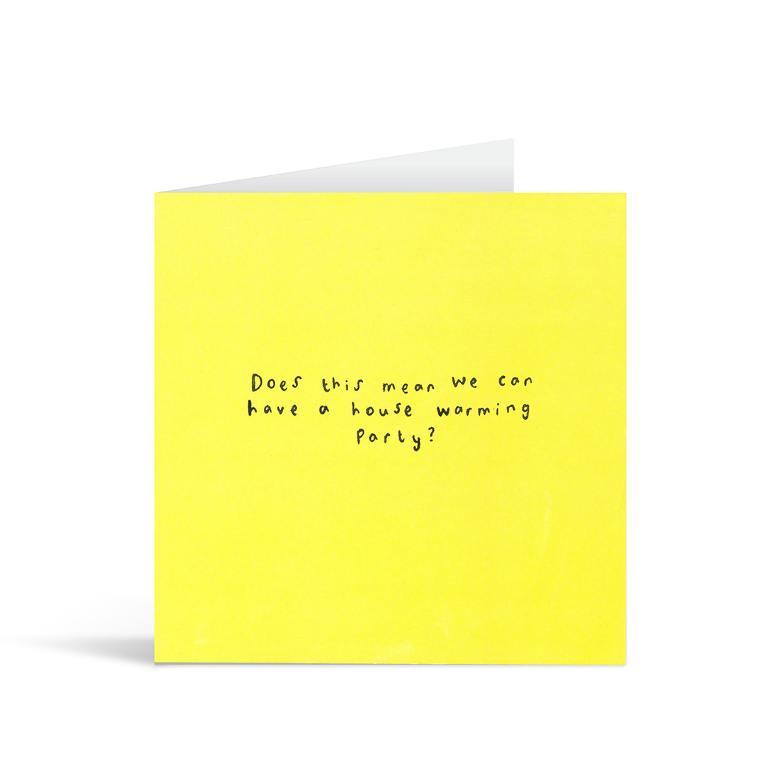 A textured bright yellow card with the handwritten words "Does this mean we can have a house warming party?"