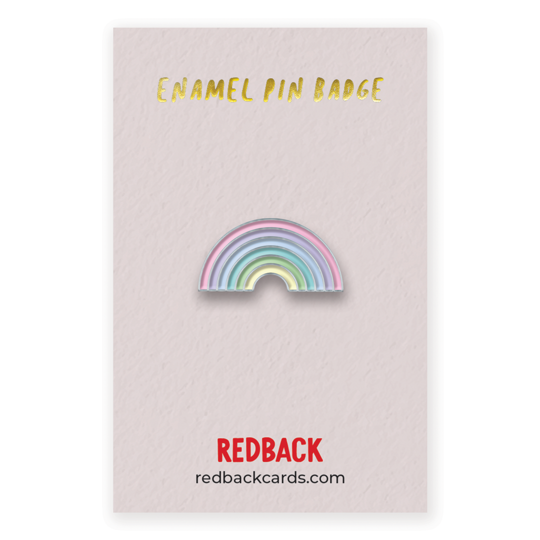 A cute pastel rainbow enamel pin with silver detailing. Mounted on card