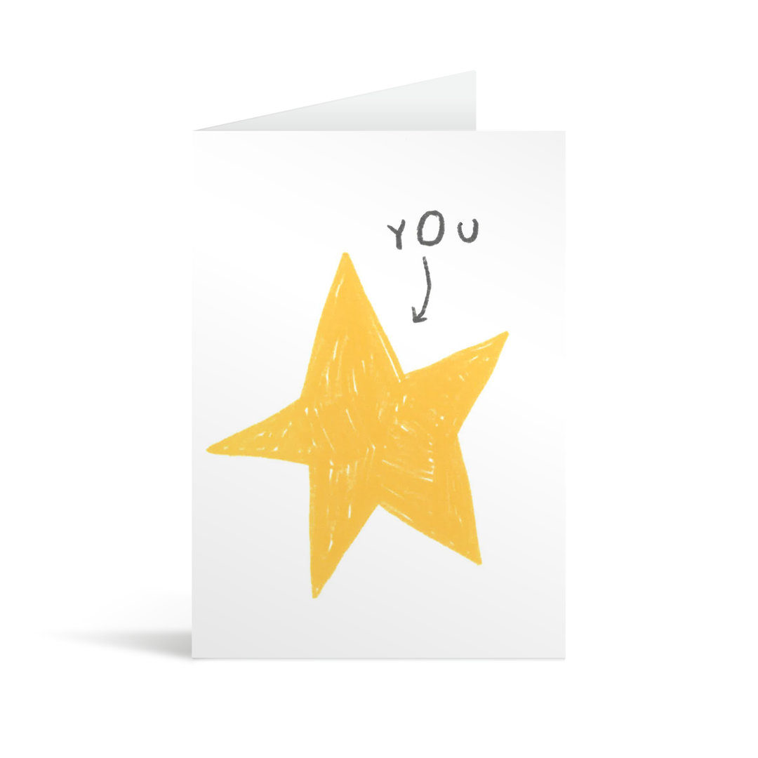 A quirky white card showing a hand drawn star with a small arrow and the word "you" pointing to it.