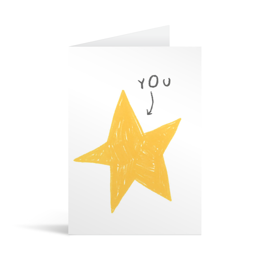 A quirky white card showing a hand drawn star with a small arrow and the word "you" pointing to it.