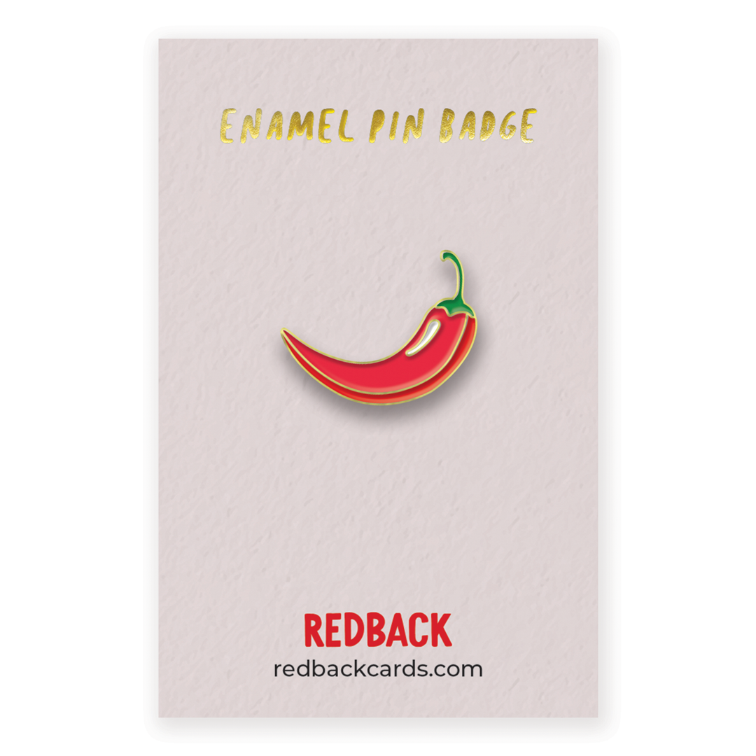 A cute red chilli pepper enamel pin with gold detailing. Mounted on card