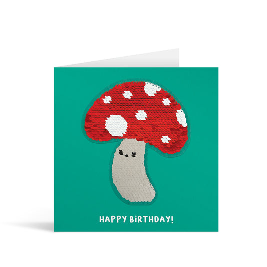 Turquoise square greetings card with colourful reversible sequin toadstool patch and fun, free-flowing text that reads "Happy Birthday!"
