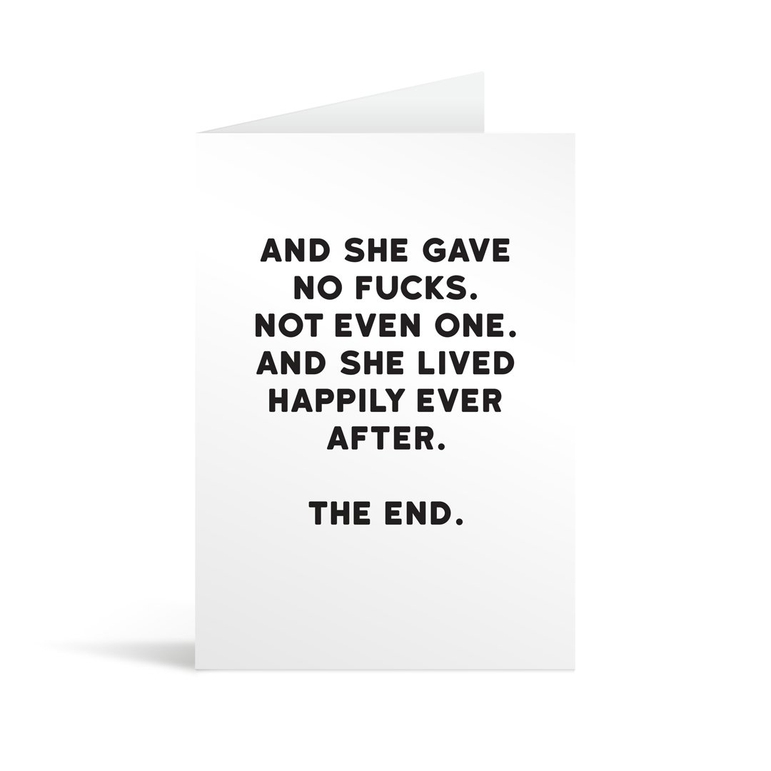 White rectangular card with black text saying: "And she gave no fucks. Not even one. And she lived happily ever after. The end."