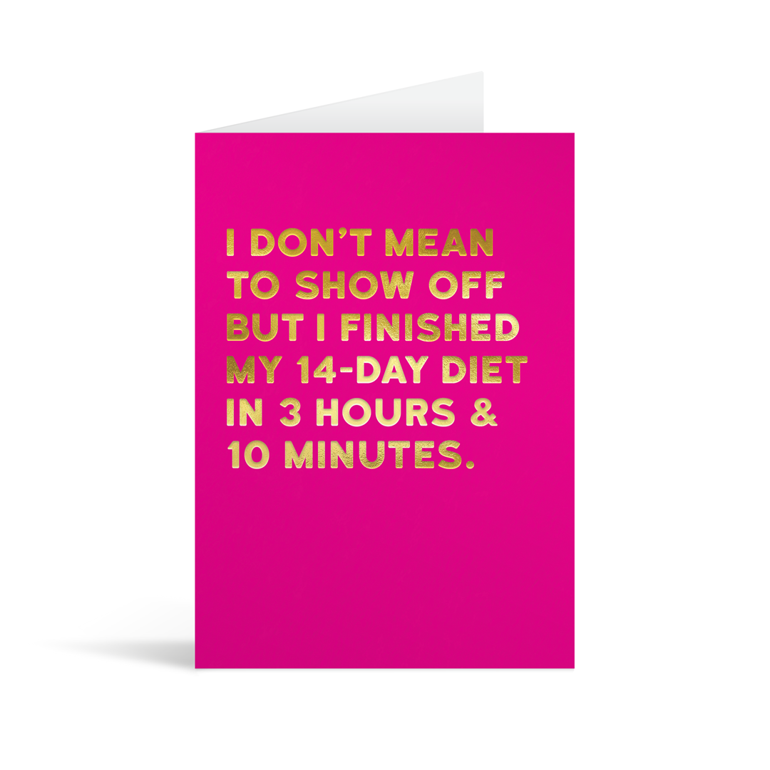 Purple rectangular card with gold foiled text saying: I don't mean to show off but I finished my 14-day diet in 3 hours & 10 minutes."