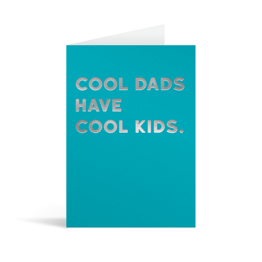 Bright blue rectangular card with funny silver foiled text Saying: "Cool dads have cool kids."