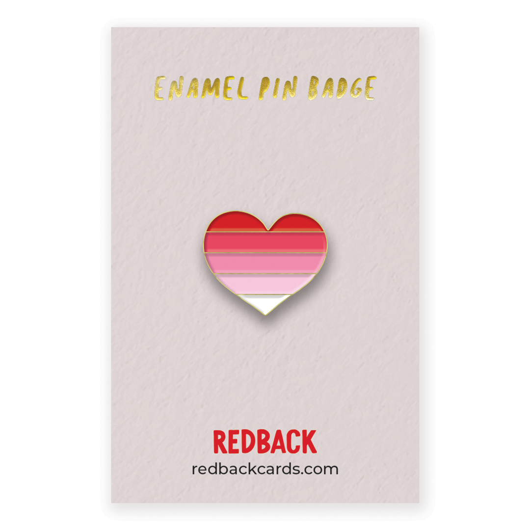 A cute heart enamel pin with a gradient going from red to white. Mounted on card