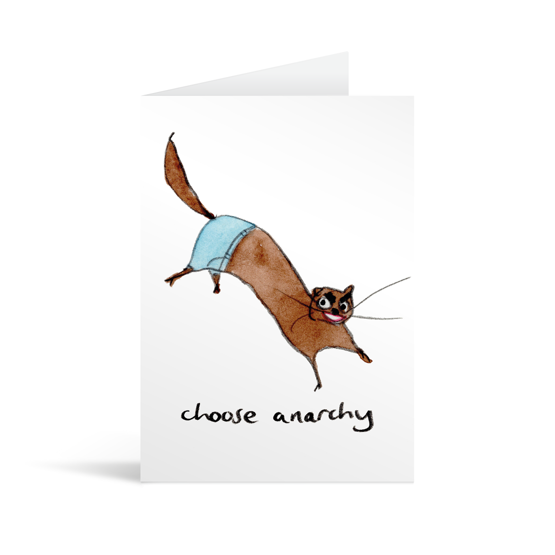 White rectangular card with an energetic, childlike picture of a stoat wearing jeans with a devilish look on his. Face above the handwritten words "Choose anarchy". Brown envelope in the background.